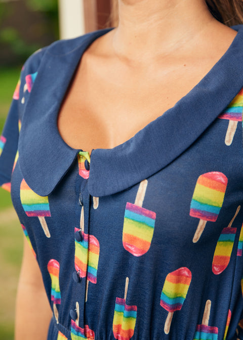 Close-up of collar and button-front dress detail with rainbow popsicle pattern