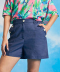 Woman wearing vintage-inspired linen blend shorts with wide-leg silhouette.