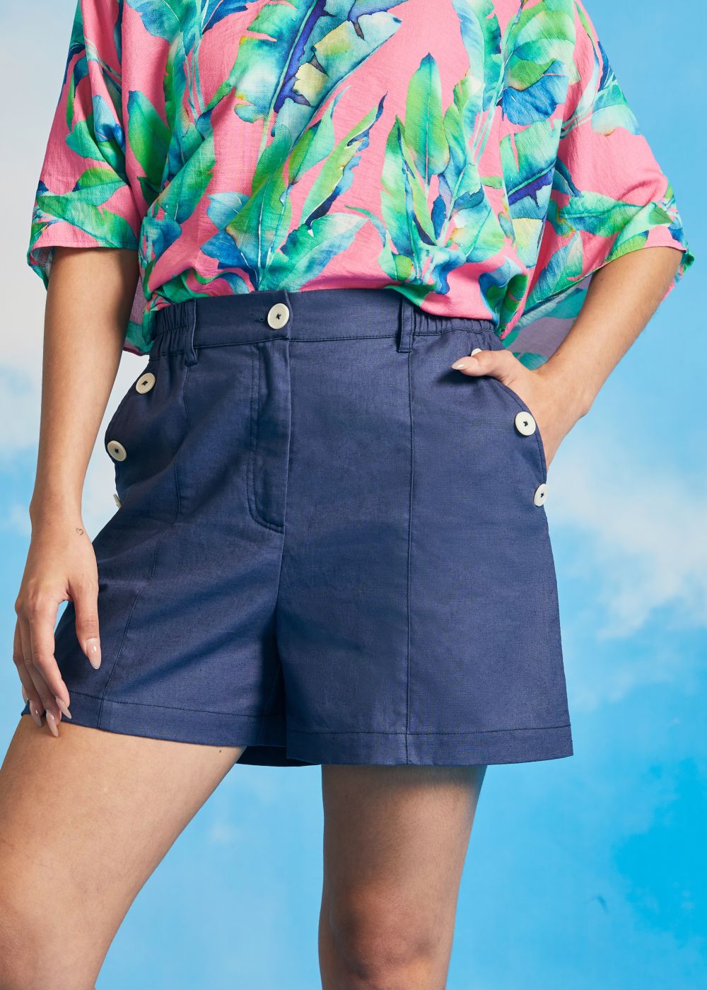 Woman wearing vintage-inspired linen blend shorts with wide-leg silhouette.