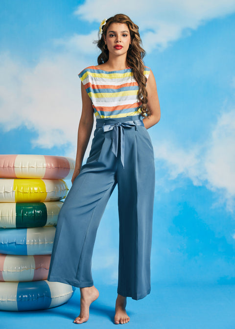 Woman wearing vintage-inspired dusty blue cropped wide leg trousers with paperbag waist and tie belt