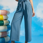 Front view of dusty blue paperbag waist cropped pants with pockets and wide leg silhouette