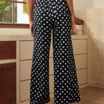 Back view of wide leg palazzo pants with elastic waistband and relaxed fit