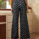 Back view of wide leg palazzo pants with elastic waistband and relaxed fit