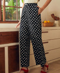 Wide leg palazzo pants with elastic waistband and polka dot print, front view
