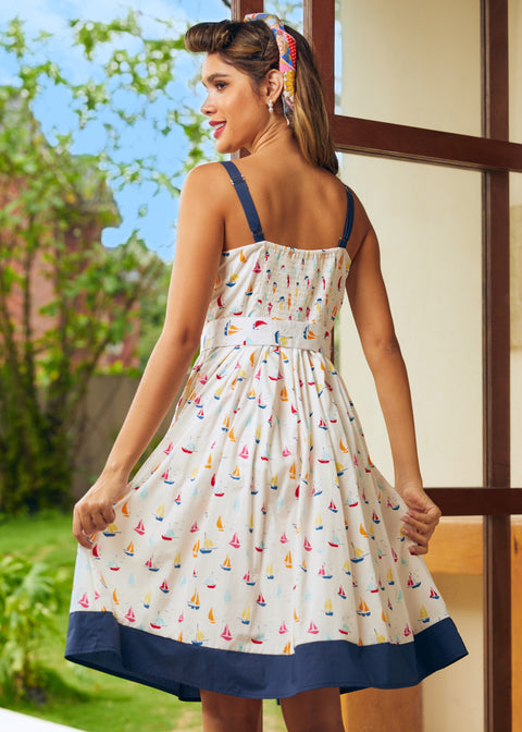 Back view showing smocked panel and adjustable straps