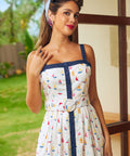Woman wearing a dress with sailboat pattern outdoors