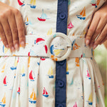 Close-up of matching belt and waist detail on sailboat print dress