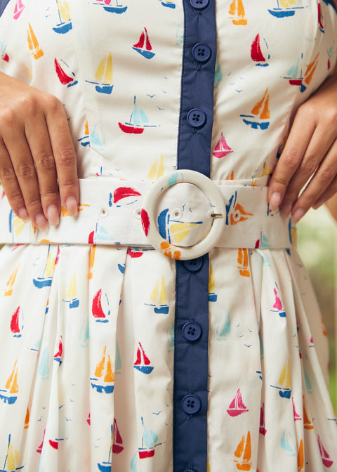 Close-up of matching belt and waist detail on sailboat print dress