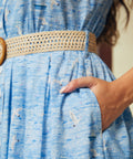 Close-up of side pocket detail on Breezy Boardwalk light blue cotton Shirt Dress with seagulls and boats print