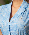 Close-up of collar and button-front bodice on blue coastal print shirt dress