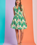 Full-length view of sleeveless tropical leaf print dress with vintage silhouette