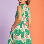 Back view of tropical fruit print fit-and-flare dress with belted waist
