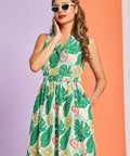 Woman wearing colorful citrus print cotton dress with cat-eye sunglasses