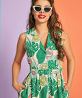 Close-up of collared V-neckline and button-front detail on tropical print dress