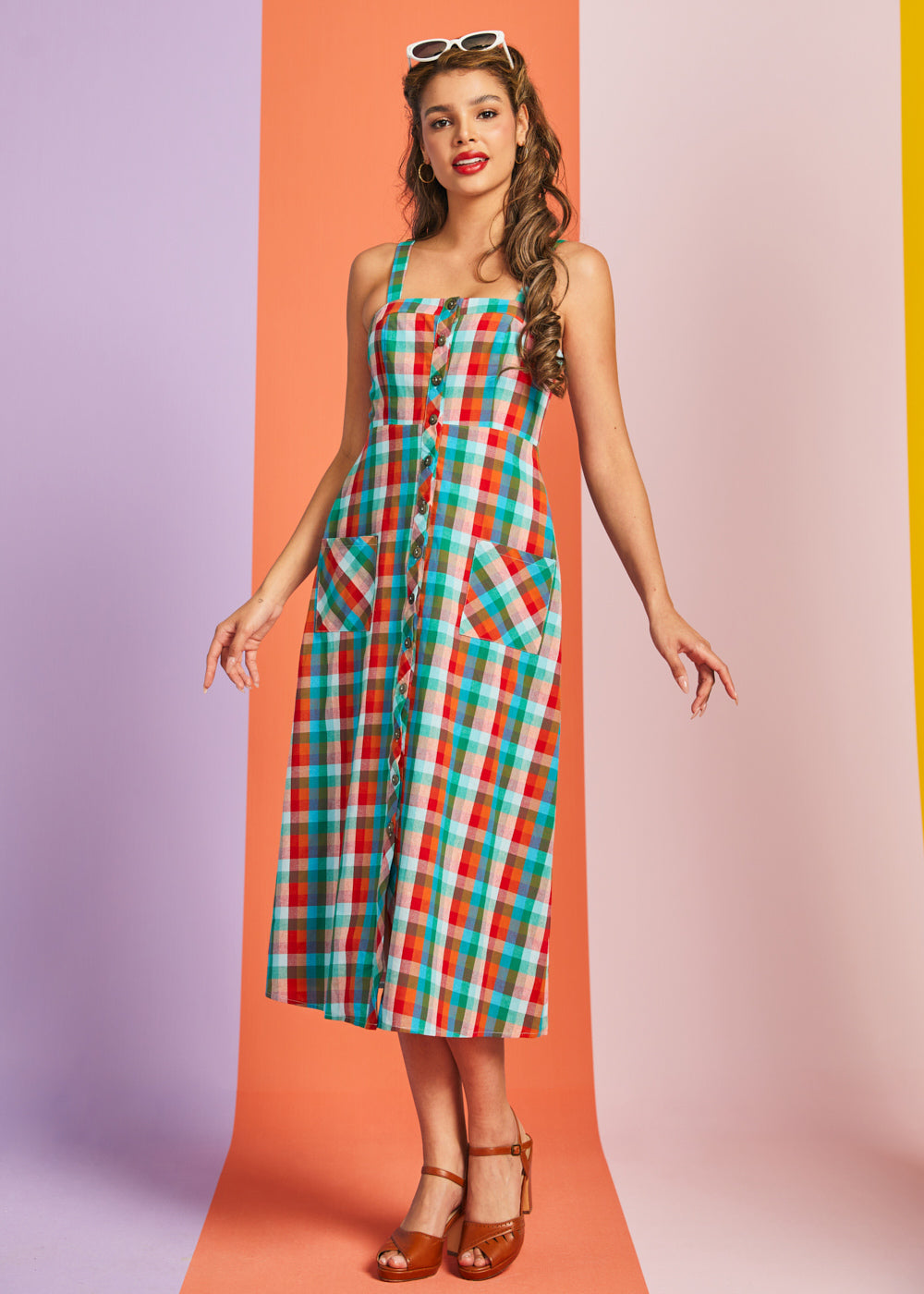 Woman wearing multicolor plaid cotton midi dress with button-front closure