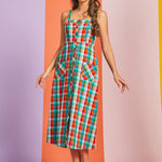 Woman wearing multicolor plaid cotton midi dress with button-front closure