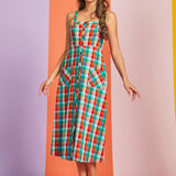 Woman wearing multicolor plaid cotton midi dress with button-front closure