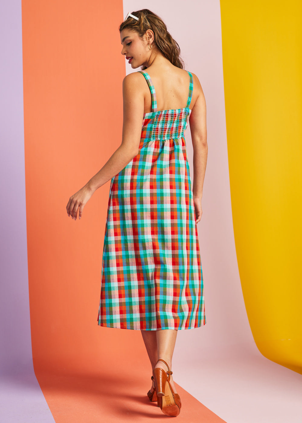 Back view of rainbow plaid midi dress with stretchy smocked back panel