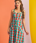 Woman modeling sleeveless plaid sundress with square neckline
