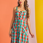 Woman modeling sleeveless plaid sundress with square neckline