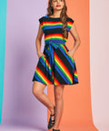 Full-length view of rainbow stripe boatneck dress with cap sleeves and twirl-ready skirt