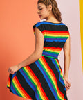 Back view of rainbow stripe dress with cap sleeves and fitted waist detail