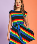 Woman wearing rainbow pride striped cotton dress