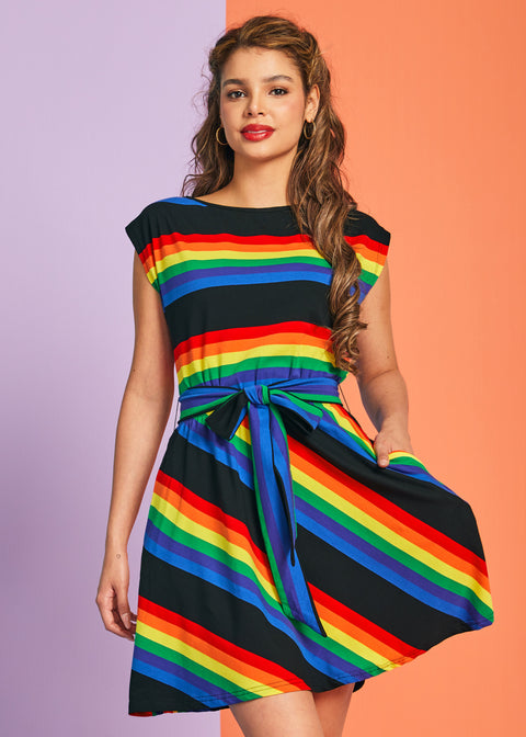 Woman wearing rainbow pride striped cotton dress