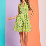 Woman modeling vintage-inspired cat print dress with button-front bodice and matching belt