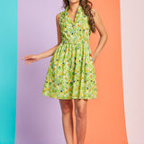 Woman modeling vintage-inspired cat print dress with button-front bodice and matching belt