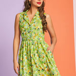 Woman wearing retro-inspired hidden kitty print dress with pockets and full skirt