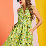 Woman posing in retro cat print cotton dress with belted waist and full skirt