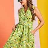 Woman posing in retro cat print cotton dress with belted waist and full skirt