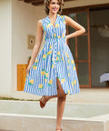 Woman wearing a vintage-inspired sleeveless lemon print midi dress with full button front.