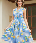 Woman modeling the Lemon Stripe fit and flare dress outdoors.