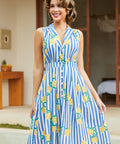 Woman twirling in a sleeveless lemon stripe midi dress with pockets.