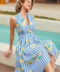 Woman wearing a sleeveless lemon stripe fit and flare dress with a notched collar by a pool.