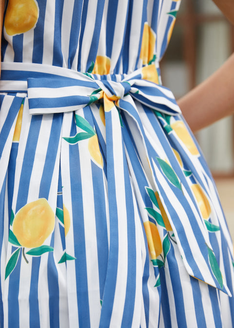 Detail of the attached striped back waist tie on blue striped dress.