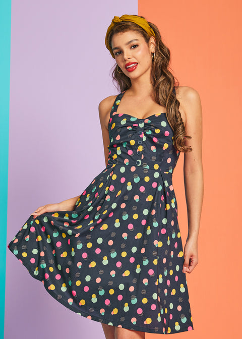 Front view of colorful dotted mini dress with decorative button-front bodice