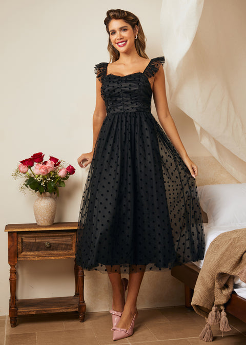 Black tulle fit and flare dress with polka dot mesh overlay and flutter straps, front view