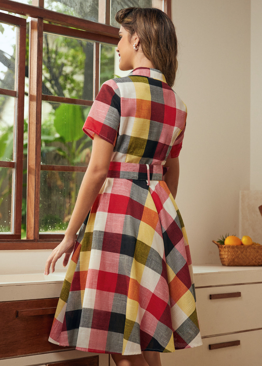 Back view of the wine plaid shirt dress with removable matching belt and full skirt.