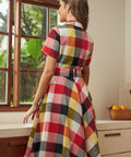 Back view of the wine plaid shirt dress with removable matching belt and full skirt.