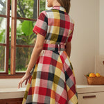 Back view of the wine plaid shirt dress with removable matching belt and full skirt.