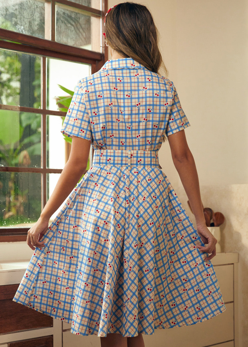 Back view of the blue plaid fit-and-flare dress with a removable matching belt.