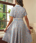 Back view of the blue plaid fit-and-flare dress with a removable matching belt.