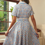 Back view of the blue plaid fit-and-flare dress with a removable matching belt.