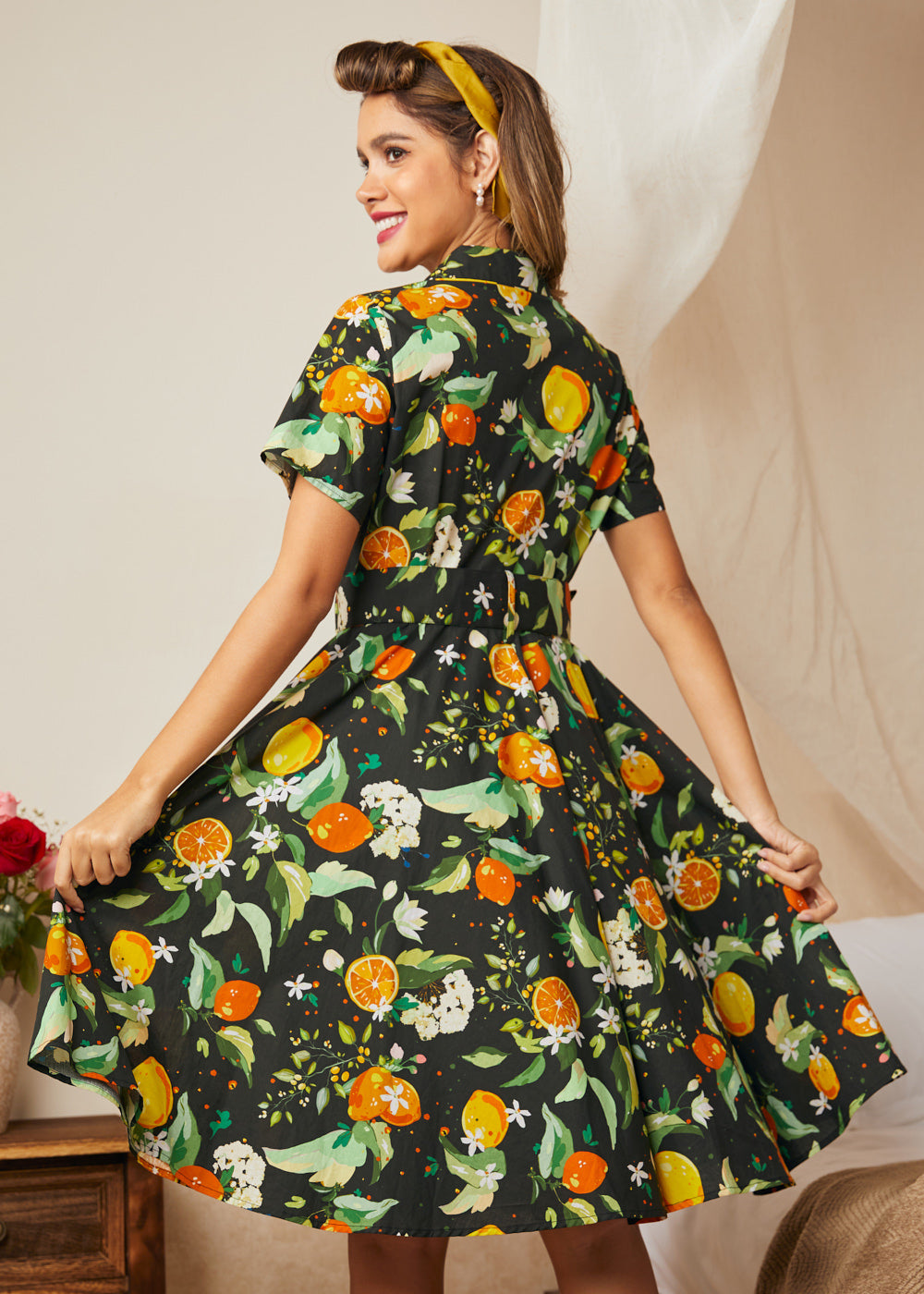 Back view of a vintage-inspired citrus print cotton fit-and-flare dress.