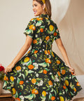 Back view of a vintage-inspired citrus print cotton fit-and-flare dress.