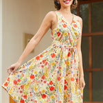 Woman twirling in a retro-inspired floral faux wrap dress with a full skirt and vibrant botanical print.