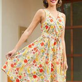 Woman twirling in a retro-inspired floral faux wrap dress with a full skirt and vibrant botanical print.